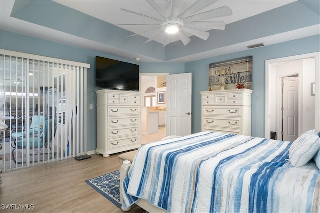 bedroom featuring light wood-style floors, access to outside, baseboards, and a ceiling fan