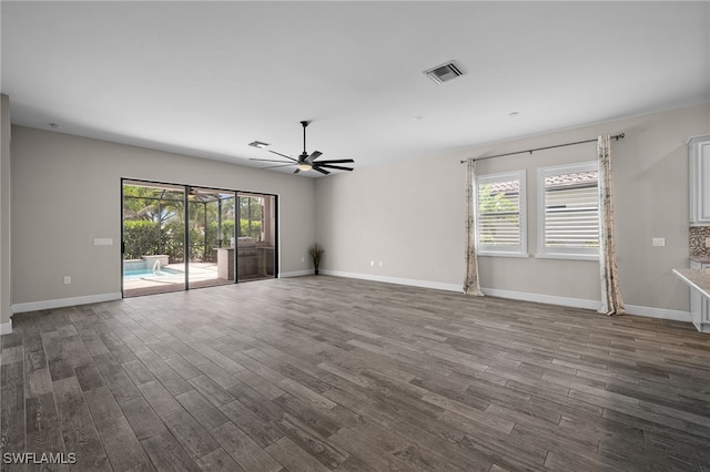 10626 Essex Square Blvd, Fort Myers, FL 33913 - empty room with ceiling fan, dark wood finished floors, and plenty of natural light