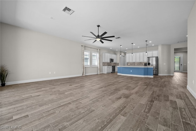 10626 Essex Square Blvd, Fort Myers, FL 33913 - unfurnished living room with light wood-style flooring, ceiling fan, baseboards, and recessed lighting