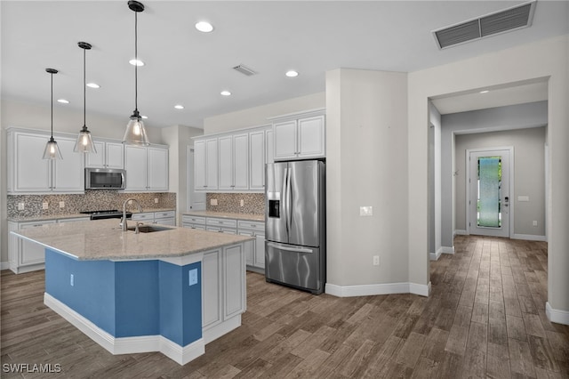 10626 Essex Square Blvd, Fort Myers, FL 33913 - kitchen with stainless steel appliances, a sink, dark wood finished floors, decorative backsplash, and recessed lighting