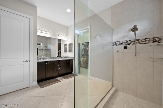 10626 Essex Square Blvd, Fort Myers, FL 33913 - bathroom with walk in shower, double vanity, a walk in closet, and tile patterned flooring
