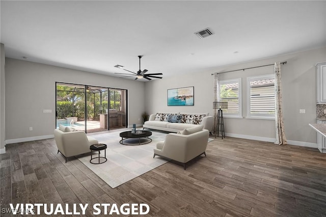 10626 Essex Square Blvd, Fort Myers, FL 33913 - living room featuring wood finished floors, ceiling fan, healthy amount of natural light, and baseboards