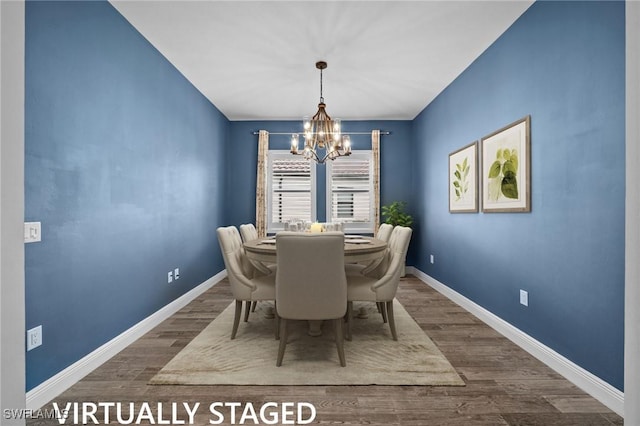 10626 Essex Square Blvd, Fort Myers, FL 33913 - dining area featuring a chandelier, dark wood-style floors, and baseboards
