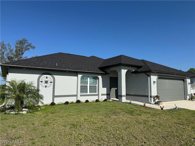 ranch-style home featuring stucco siding, a garage, concrete driveway, a front yard, and a shingled roof