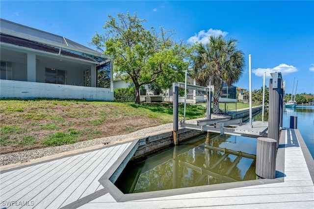 1976 San Marco Rd, Marco Island, FL 34145 - dock featuring boat lift and a water view