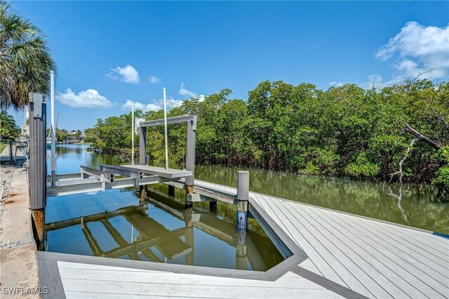 1976 San Marco Rd, Marco Island, FL 34145 - dock area featuring a water view and view of wooded area