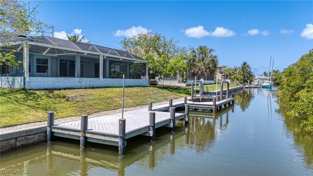 1976 San Marco Rd, Marco Island, FL 34145 - dock featuring a water view, a lawn, and glass enclosure