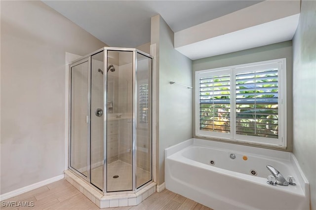 1976 San Marco Rd, Marco Island, FL 34145 - full bathroom with a shower stall, a tub with jets, and wood finished floors