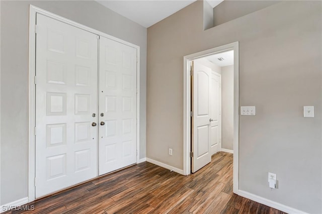 1976 San Marco Rd, Marco Island, FL 34145 - entryway featuring dark wood-type flooring and baseboards