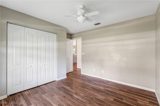 1976 San Marco Rd, Marco Island, FL 34145 - unfurnished bedroom featuring wood finished floors, a closet, and a ceiling fan