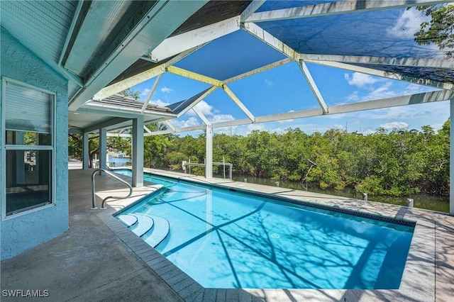 1976 San Marco Rd, Marco Island, FL 34145 - swimming pool with a patio area, a lanai, and view of scattered trees