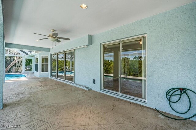 1976 San Marco Rd, Marco Island, FL 34145 - view of patio with a ceiling fan and an outdoor pool