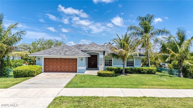 1976 San Marco Rd, Marco Island, FL 34145 - ranch-style house featuring stucco siding, a garage, and driveway