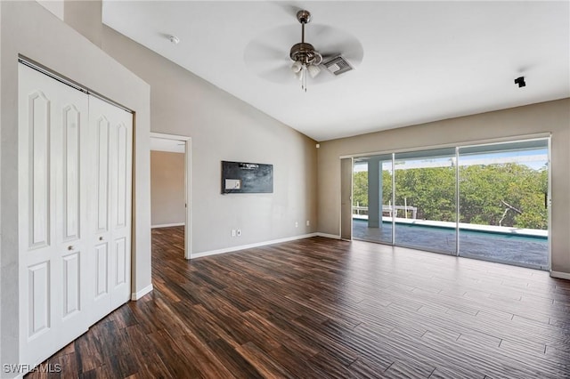 1976 San Marco Rd, Marco Island, FL 34145 - unfurnished living room featuring lofted ceiling, a ceiling fan, and dark wood-style flooring