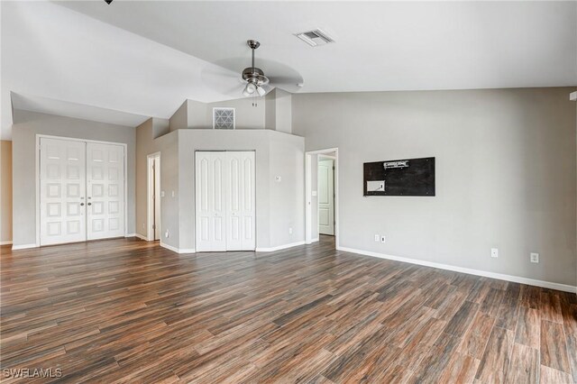 1976 San Marco Rd, Marco Island, FL 34145 - unfurnished bedroom with two closets, dark wood-type flooring, high vaulted ceiling, and a ceiling fan
