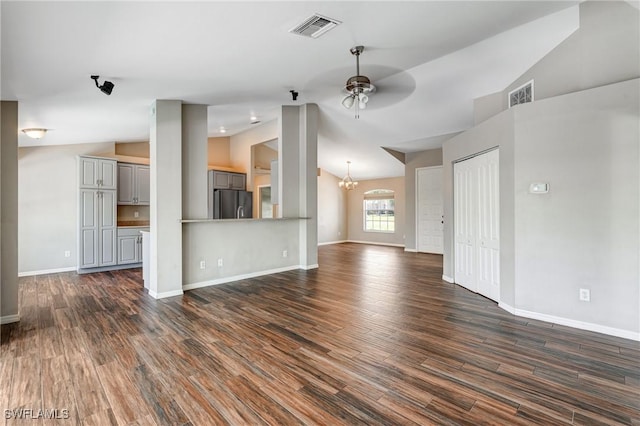1976 San Marco Rd, Marco Island, FL 34145 - unfurnished living room with vaulted ceiling, dark wood-style floors, a ceiling fan, and a chandelier