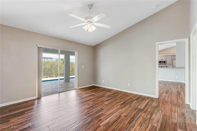 1976 San Marco Rd, Marco Island, FL 34145 - spare room with vaulted ceiling, dark wood-type flooring, and a ceiling fan