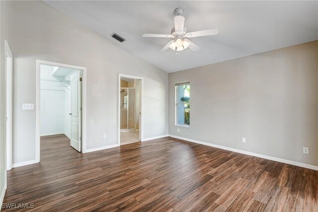 1976 San Marco Rd, Marco Island, FL 34145 - unfurnished bedroom featuring vaulted ceiling, dark wood finished floors, a spacious closet, a closet, and ceiling fan