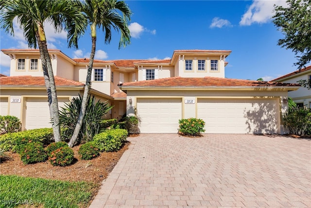 3131 Meandering Way Unit 202, Fort Myers, FL 33905 - view of front of house featuring decorative driveway and stucco siding