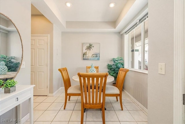 dining room with light tile patterned floors, recessed lighting, and baseboards