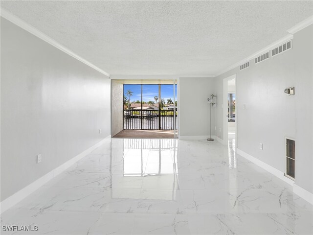 4280 SE 20th Pl Unit 207, Cape Coral, FL 33904 - unfurnished room featuring ornamental molding, a textured ceiling, baseboards, marble tiled floors, and a water view
