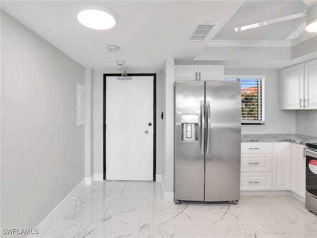 4280 SE 20th Pl Unit 207, Cape Coral, FL 33904 - kitchen featuring stainless steel appliances, light marble finish floors, white cabinetry, baseboards, and crown molding