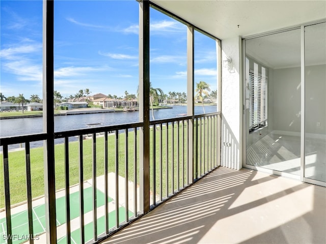 4280 SE 20th Pl Unit 207, Cape Coral, FL 33904 - unfurnished sunroom with a water view