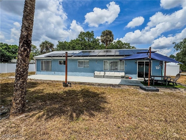 4002 Cascade Ln, Labelle, FL 33935 - rear view of property featuring a patio, stucco siding, and solar panels