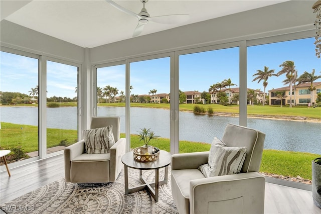 3580 Windjammer Cir Unit 1603, Naples, FL 34112 - sunroom / solarium with a water view, a residential view, and wood finished floors