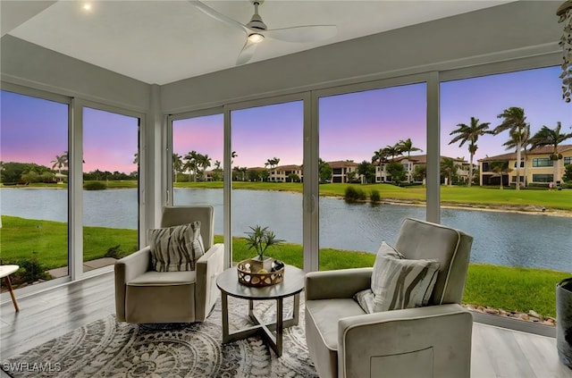 3580 Windjammer Cir Unit 1603, Naples, FL 34112 - sunroom / solarium featuring a water view, plenty of natural light, and wood finished floors