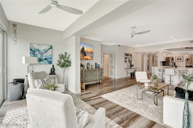 3580 Windjammer Cir Unit 1603, Naples, FL 34112 - living area featuring ceiling fan, light wood-style flooring, crown molding, baseboards, and recessed lighting