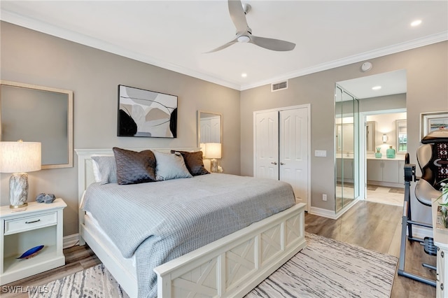 3580 Windjammer Cir Unit 1603, Naples, FL 34112 - bedroom with a closet, light wood-type flooring, crown molding, baseboards, and recessed lighting