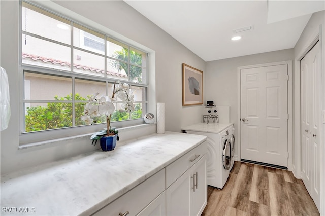 3580 Windjammer Cir Unit 1603, Naples, FL 34112 - clothes washing area with cabinet space, washer and clothes dryer, light wood-style floors, and recessed lighting