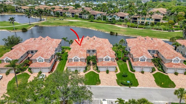 3580 Windjammer Cir Unit 1603, Naples, FL 34112 - aerial view of residential area with a nearby body of water and a golf course