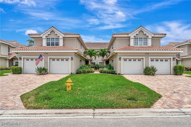 3580 Windjammer Cir Unit 1603, Naples, FL 34112 - view of front of house featuring stucco siding, a front yard, and a garage