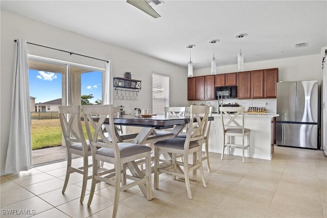 8118 Gopher Tortoise Trl, Lehigh Acres, FL 33972 - dining area featuring light tile patterned floors
