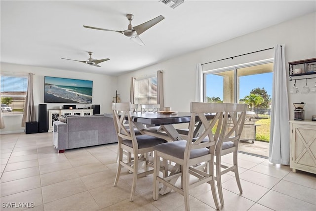 8118 Gopher Tortoise Trl, Lehigh Acres, FL 33972 - dining area with light tile patterned floors, healthy amount of natural light, and a ceiling fan