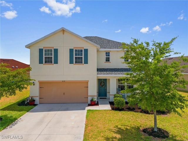 8118 Gopher Tortoise Trl, Lehigh Acres, FL 33972 - traditional-style house with a shingled roof, concrete driveway, a front yard, and stucco siding