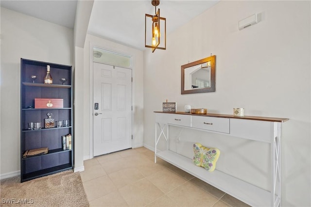 8118 Gopher Tortoise Trl, Lehigh Acres, FL 33972 - entrance foyer featuring baseboards and light tile patterned flooring