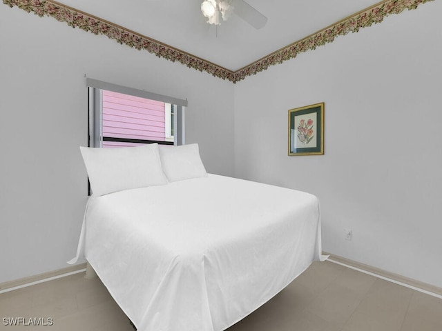 bedroom featuring baseboards, ceiling fan, and tile patterned floors