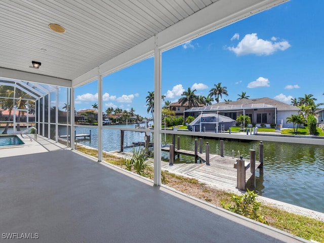 dock area featuring a water view and a residential view