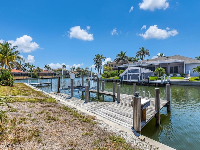 dock area featuring a water view and a residential view