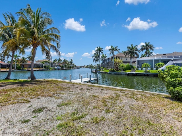 dock area featuring a water view and a residential view