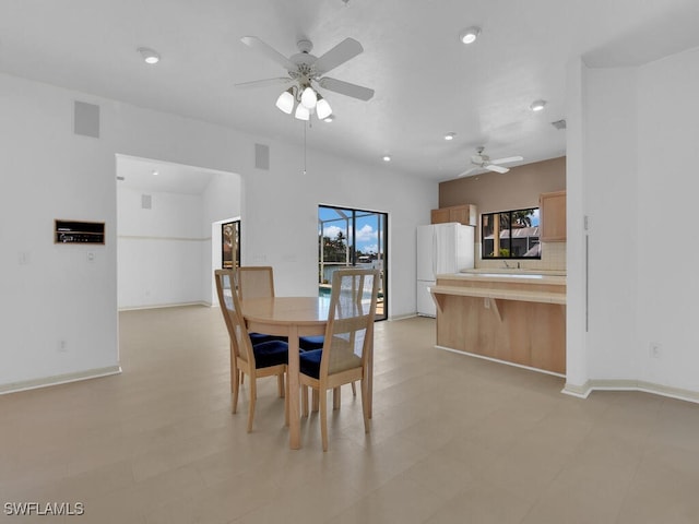 dining area featuring ceiling fan and recessed lighting