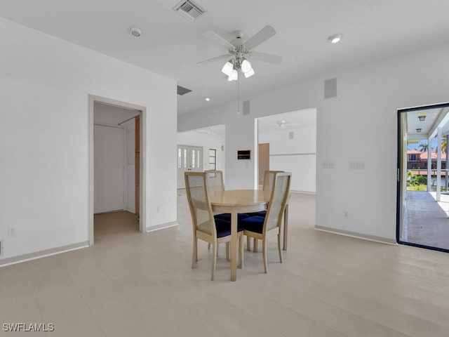 dining area featuring a ceiling fan and baseboards