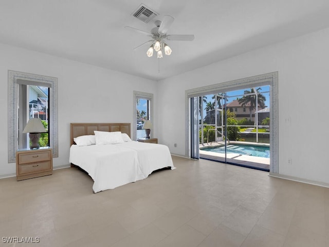 bedroom featuring access to exterior, a ceiling fan, and baseboards