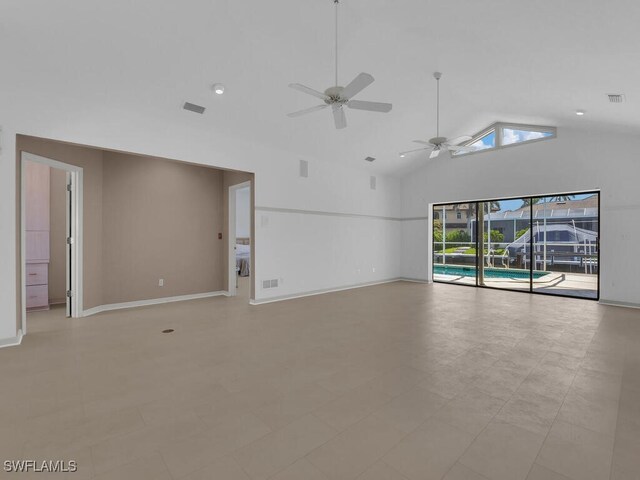 unfurnished living room with a ceiling fan, baseboards, and high vaulted ceiling