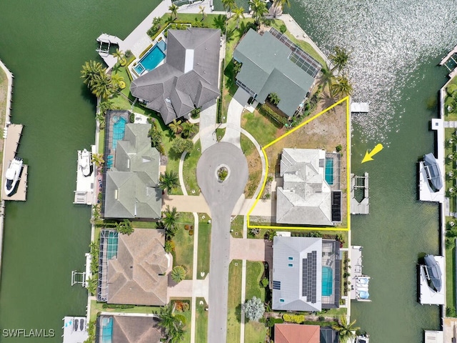 aerial perspective of suburban area featuring a pool and property boundaries highlighted