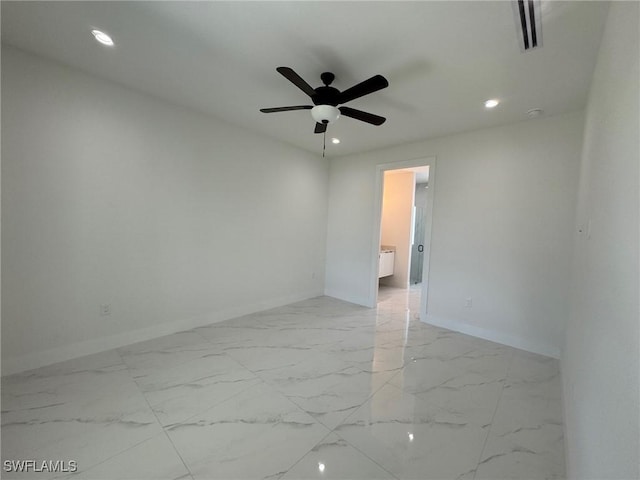 empty room featuring baseboards, light marble finish flooring, recessed lighting, and a ceiling fan