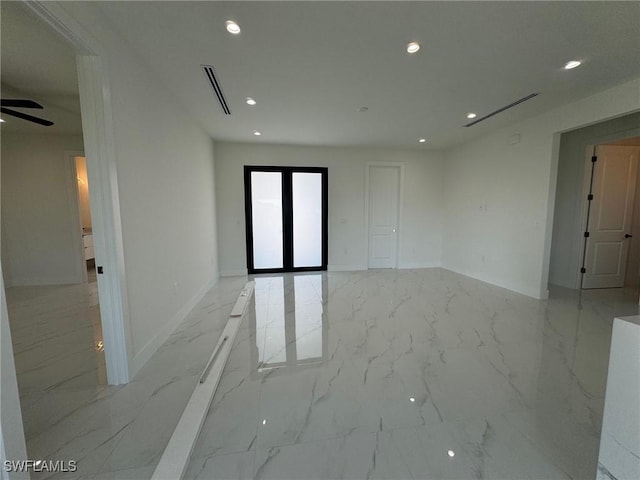 spare room with recessed lighting, light marble finish flooring, baseboards, and ceiling fan
